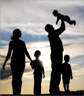 Family holding baby